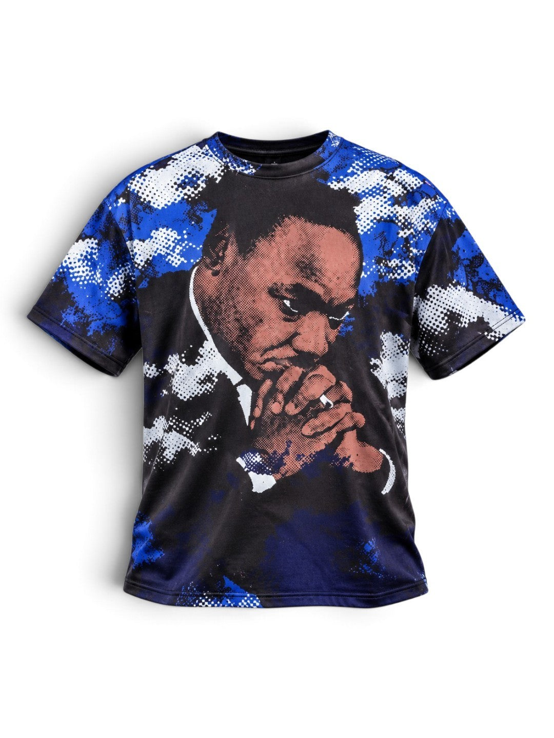 A short-sleeve crewneck t-shirt featuring a graphic print of Martin Luther King Jr. on the front, set against a blue and white digital camouflage pattern on the sleeves and sides, displayed on a clean white background.